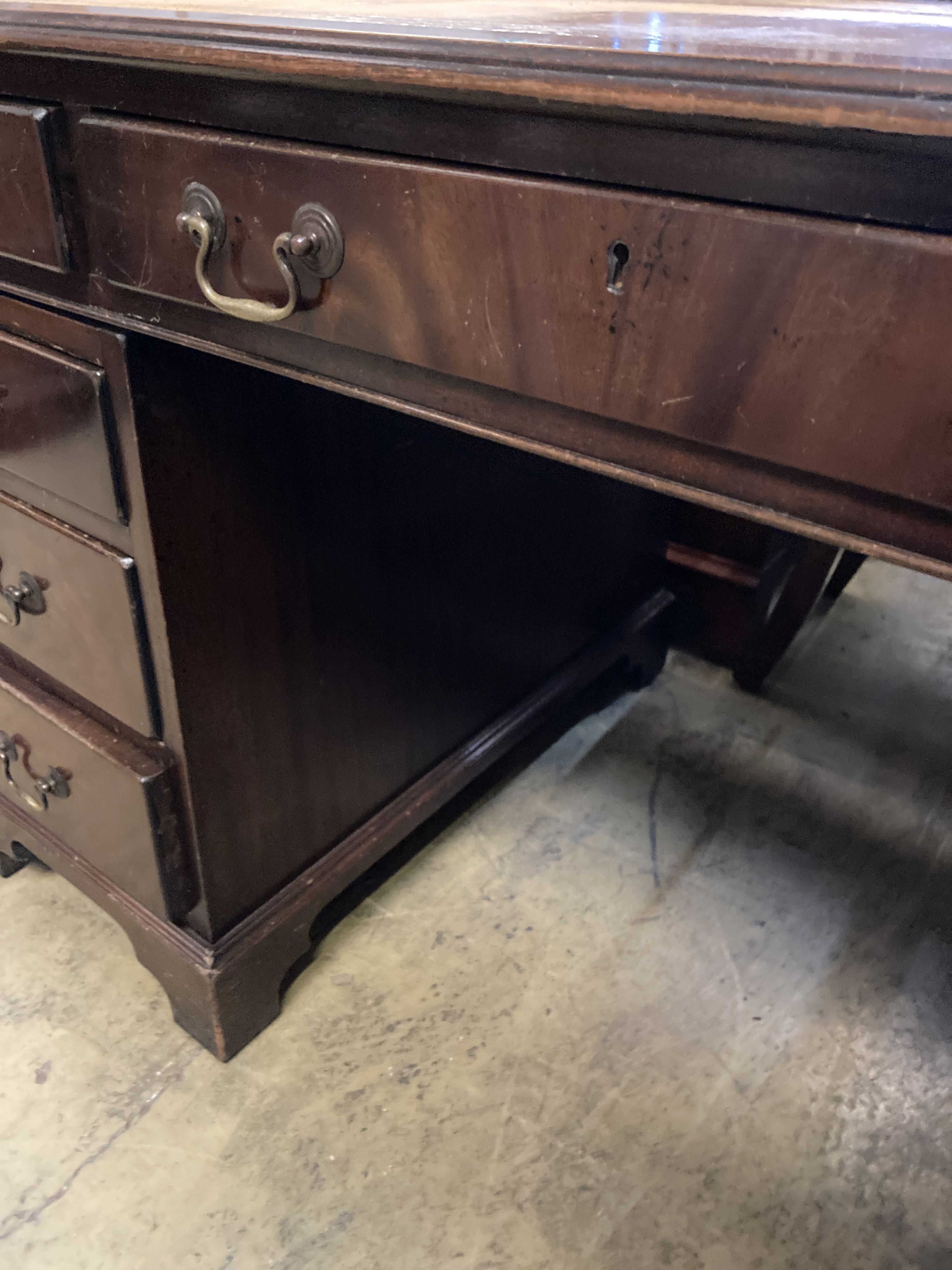 A reproduction mahogany pedestal desk, width 140cm, depth 76cm, height 78cm